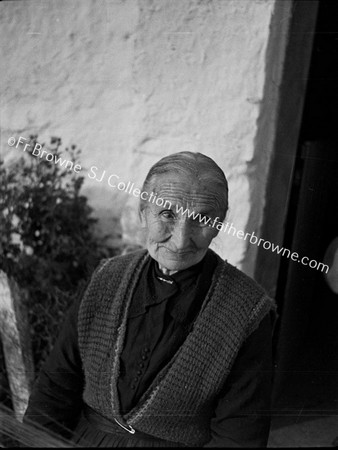 IN A COTTAGE HOUSE NEAR DRUMSHANBO WHERE THERE WAS HOME SPINNING  FR.CONEFREY & FR. GARAHY